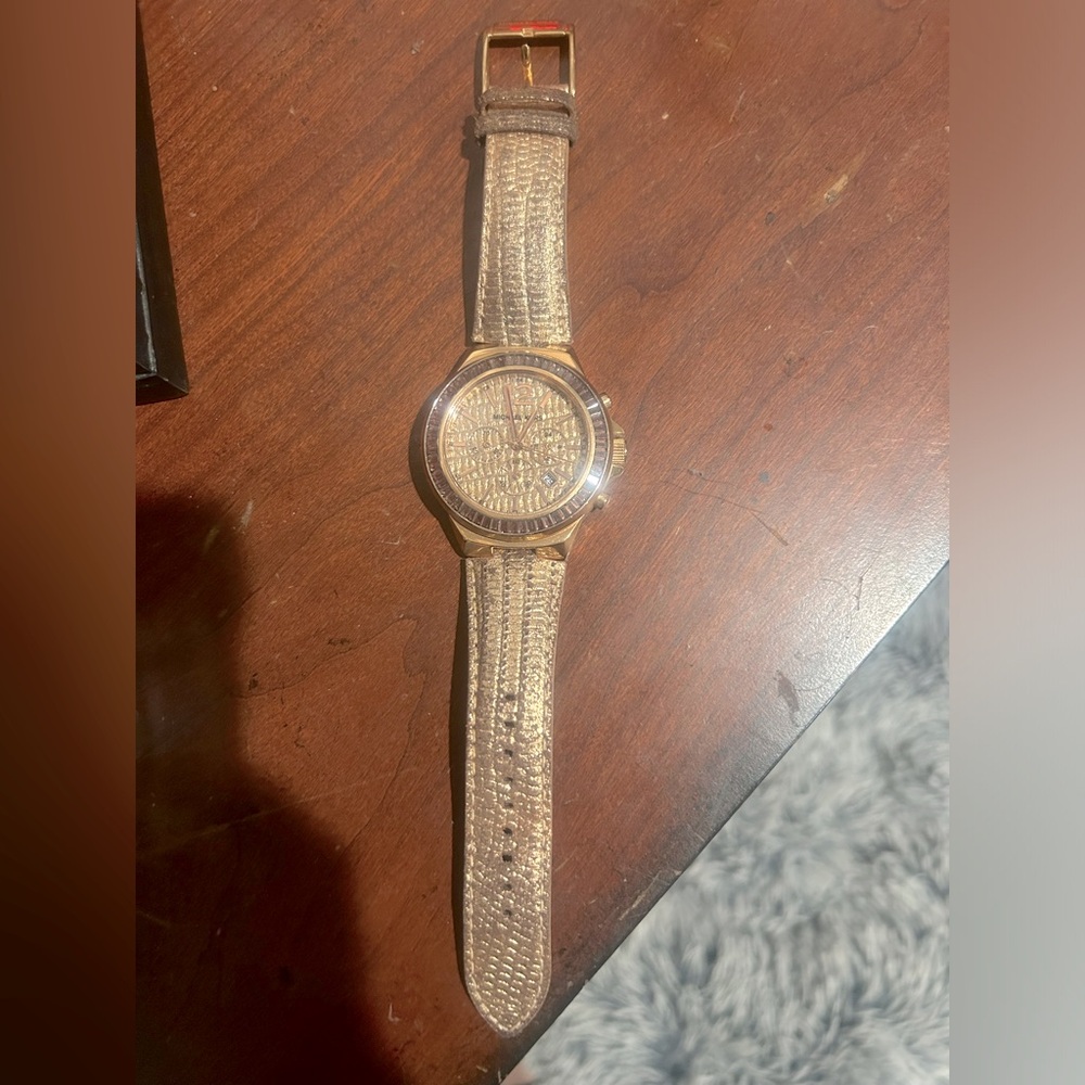 Michael Kors woman’s rose gold watch… good condition … is used… needs a battery